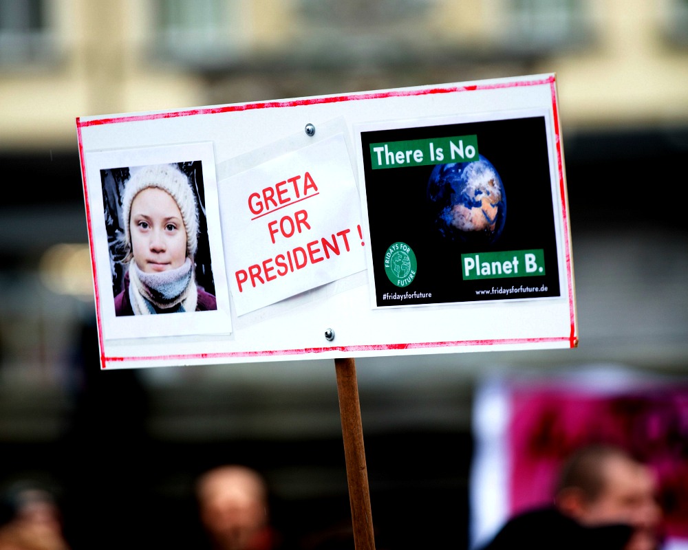 Climate change charities Greta for President sign CREDIT Markus Spiske-Unsplash 5_picmonkeyed